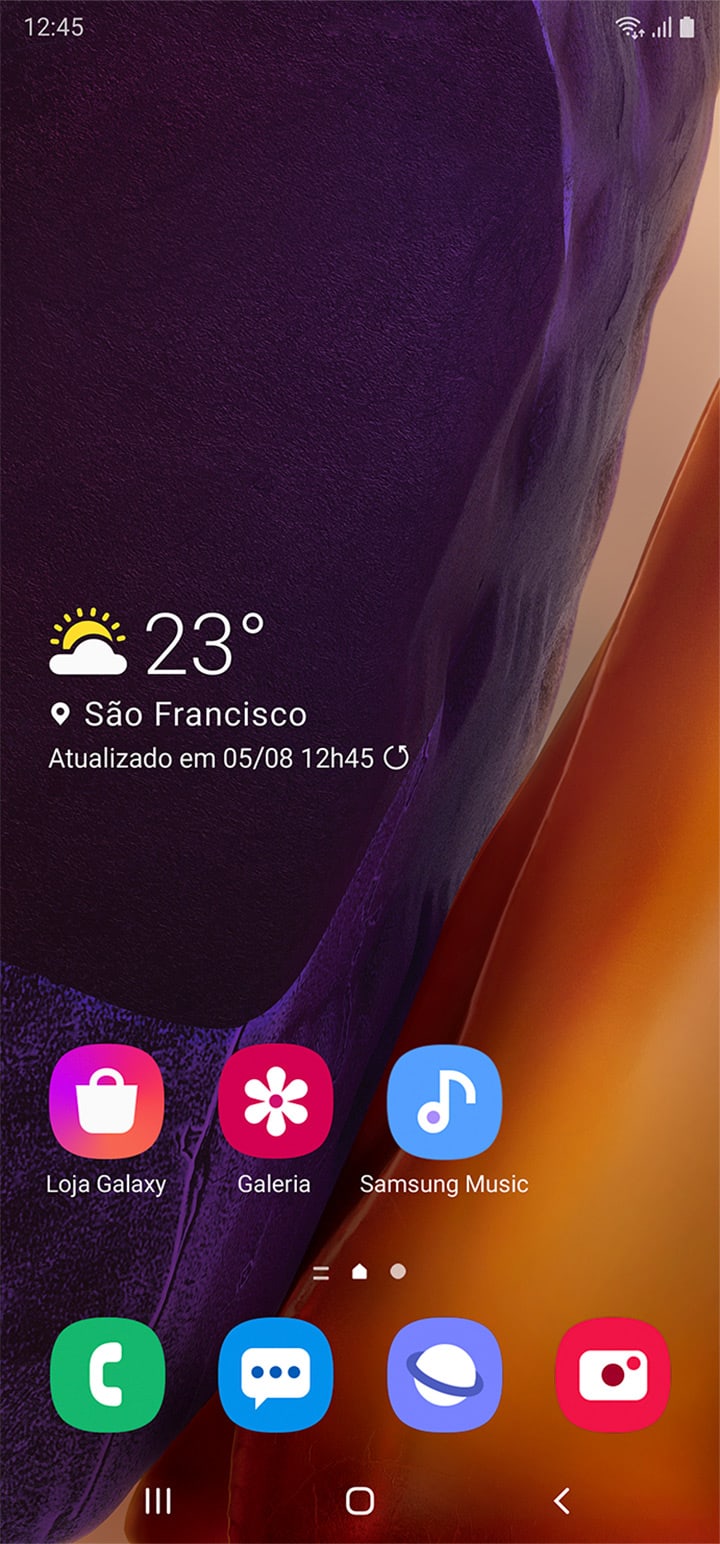 Vista frontal do Galaxy Note20 com a tela inicial exibida. Ela demonstra como é possível fazer várias tarefas com aplicativos móveis no PC e continuar usando o celular.